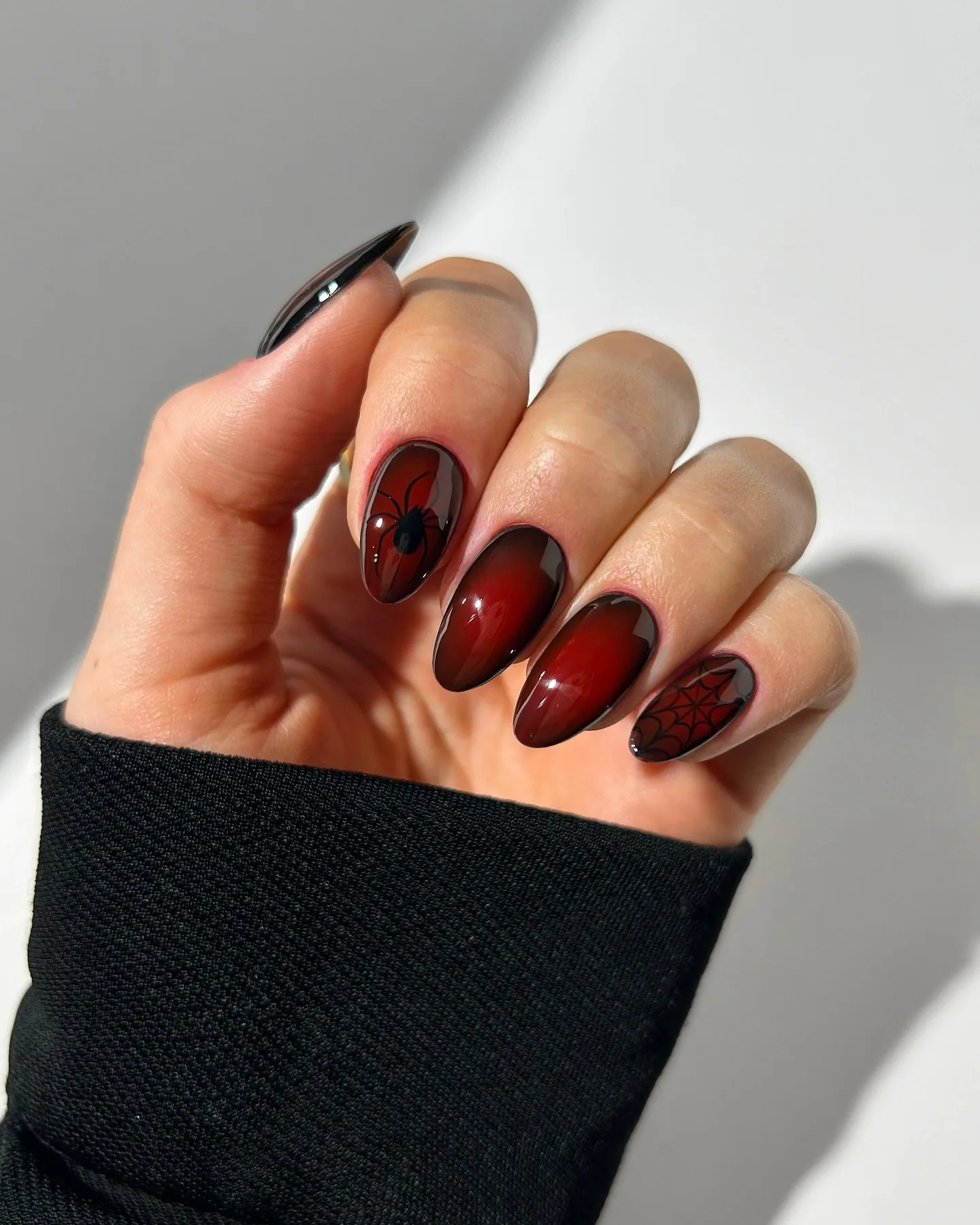 burgundy almond spider web nails