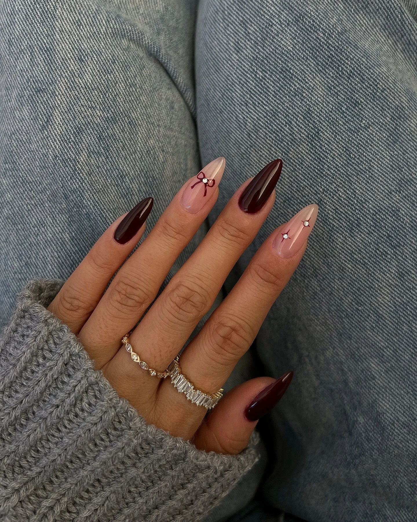 burgundy nude almond rhinestone nails