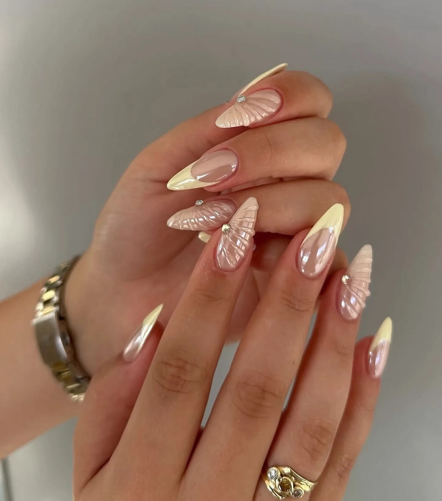 peachy nude almond butterfly nails