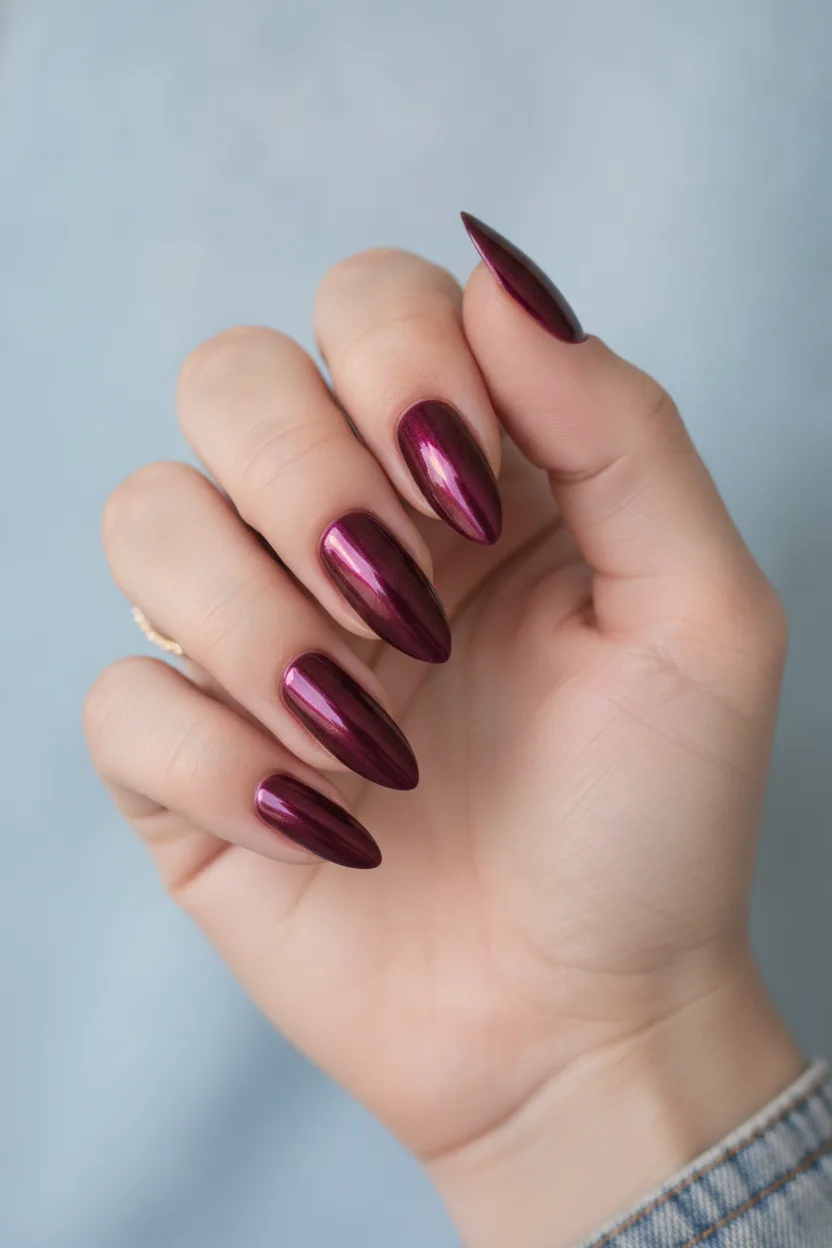Fuchsia pink and gold chrome nails flattering on deep skin tones