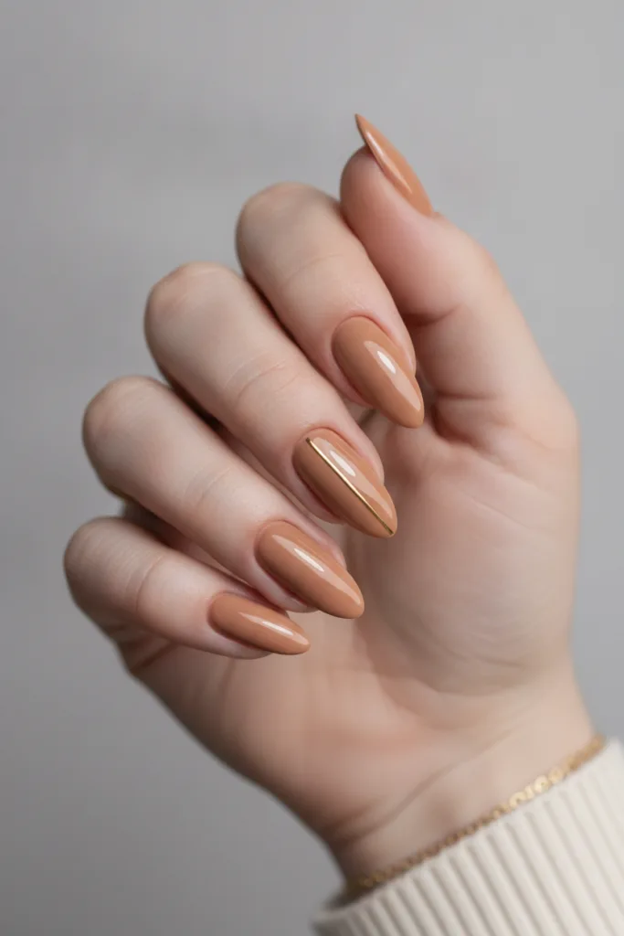 Long almond caramel nude nails showing how to choose nail color for skin tone