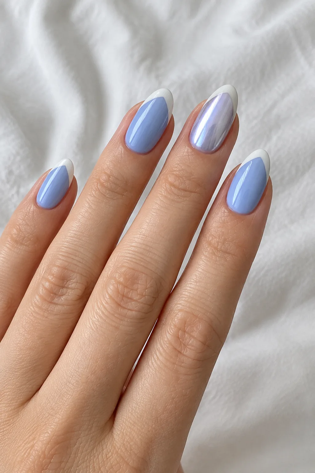 Short oval periwinkle nails with diagonal tips, a best nail shape for short fingers