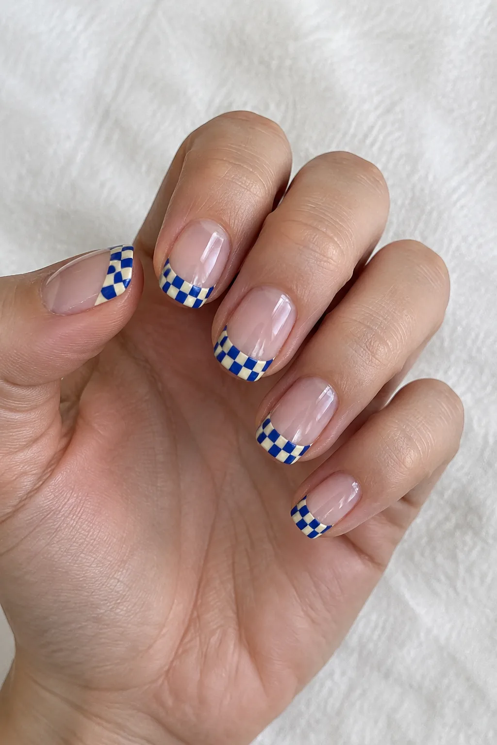 Cobalt blue checkerboard pattern French tips on short square nails