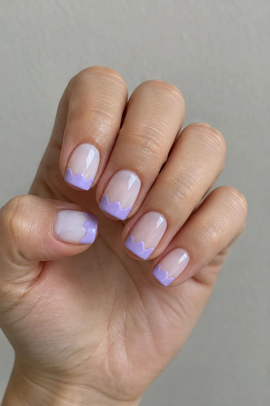 Lilac wavy squiggle French tips on short square nails with a matte finish