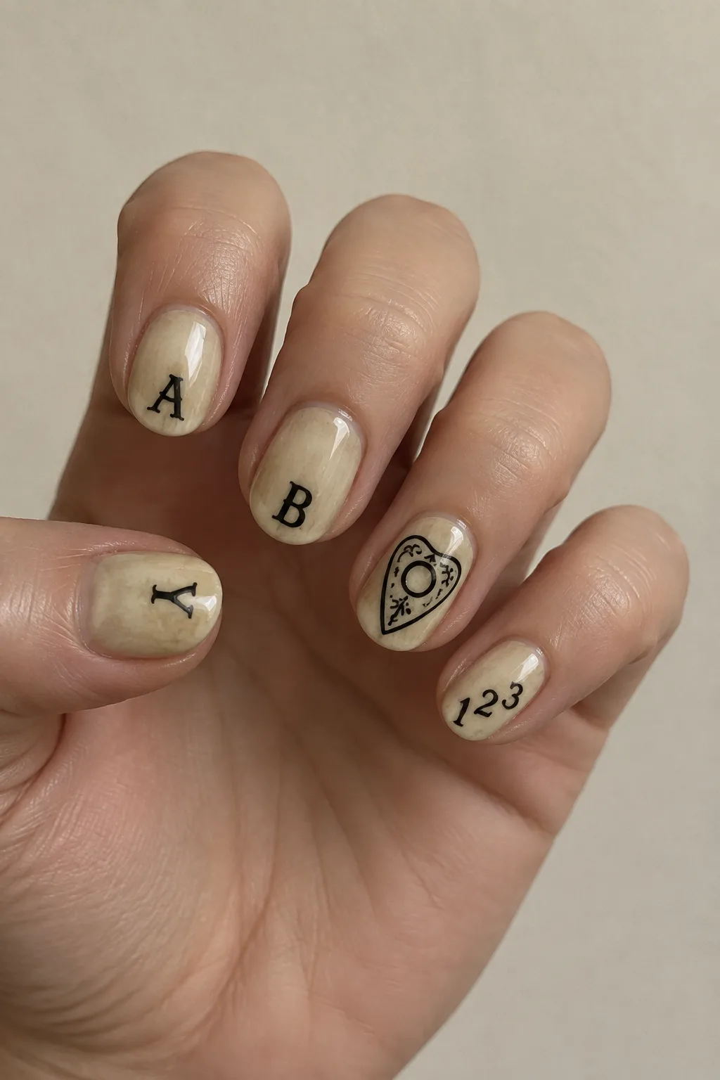 Aged parchment beige nails with Ouija board letters and planchette art
