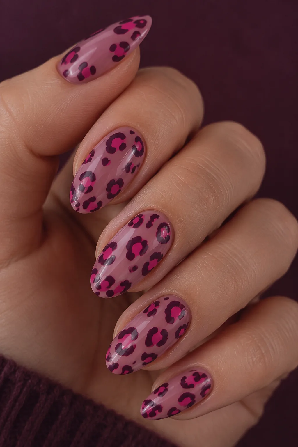 Hot pink cheetah print nails for autumn on dusty mauve base