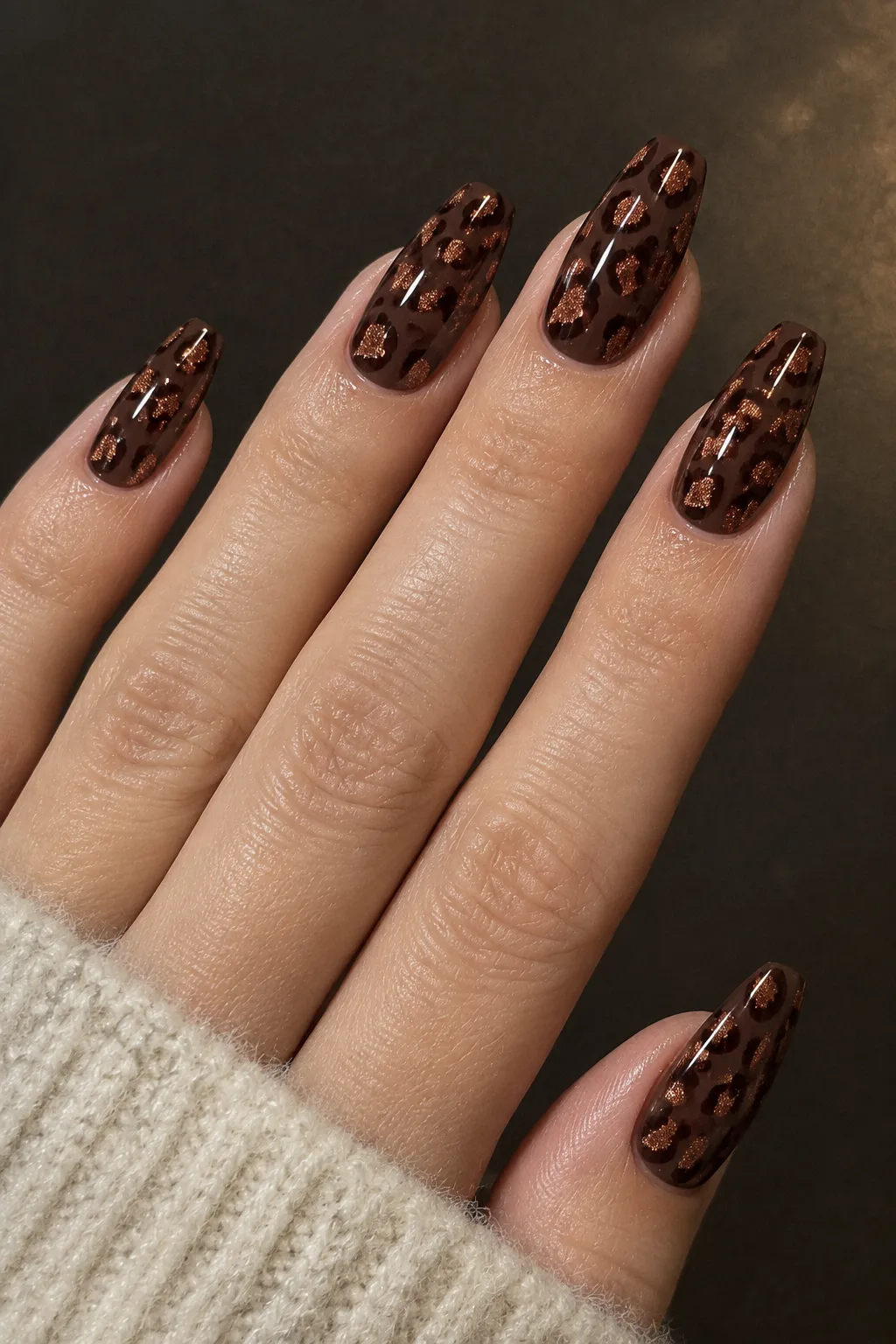 Copper glitter leopard print nails for autumn on espresso brown base