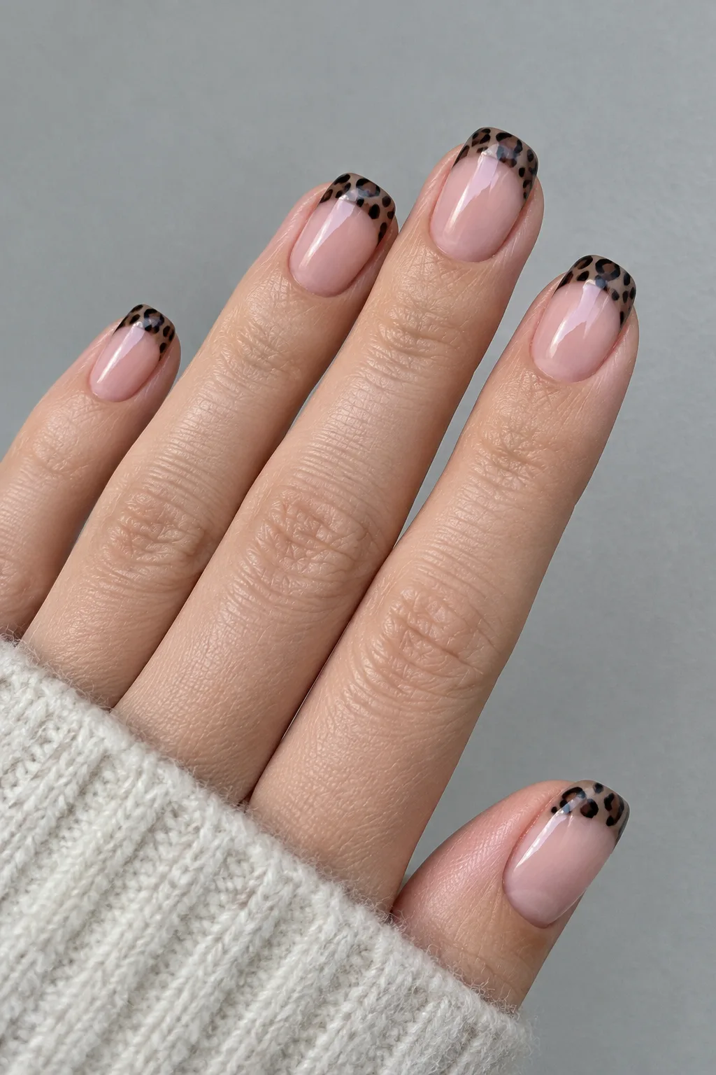 Black leopard print French tip nails for autumn on short squoval nails