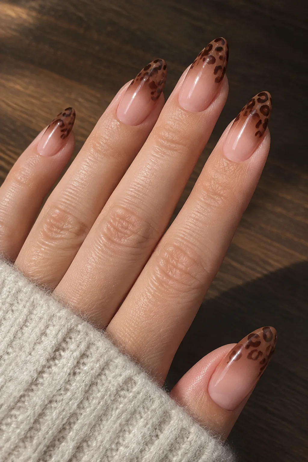 Chocolate brown ombre leopard print nails for autumn on long almond nails