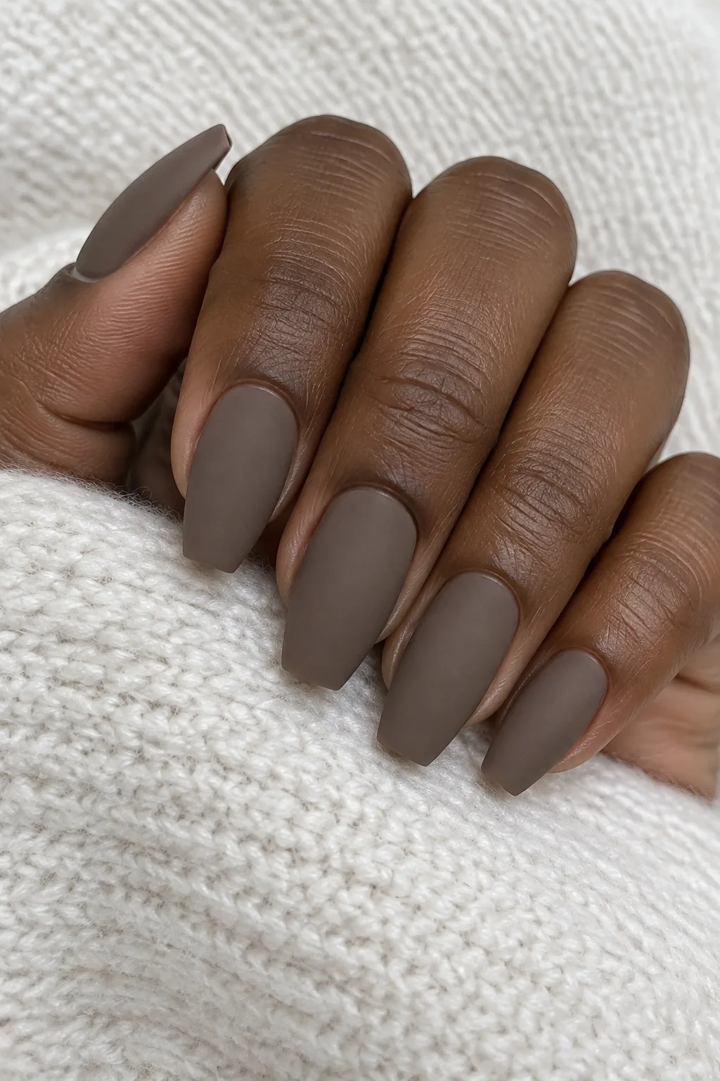 Taupe mushroom matte polish on coffin-shaped nails