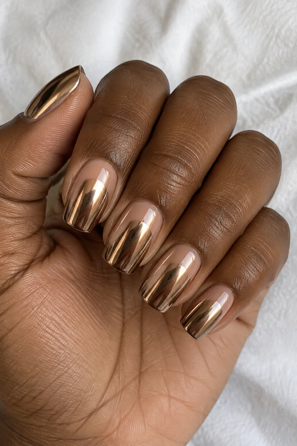 Mirror-like bronze chrome polish on square-shaped nails