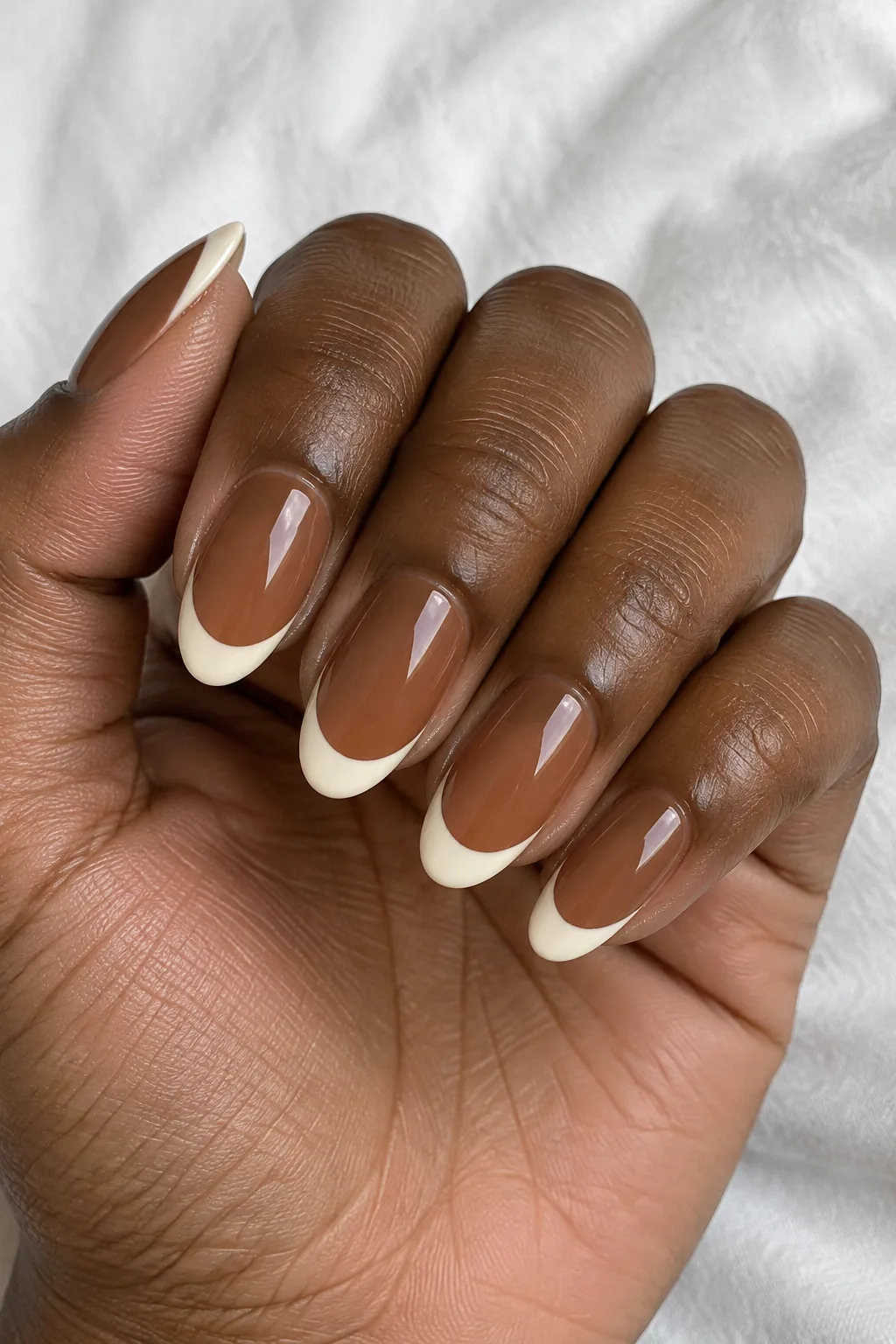 Toffee nude nails topped with crisp vanilla cream French tips