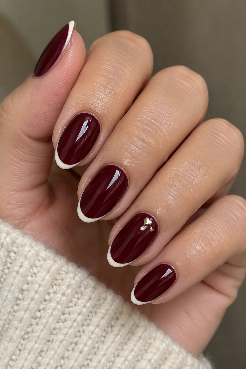 15-minute Valentine's Day nails for short nails: burgundy with cream tip lines and gold heart studs