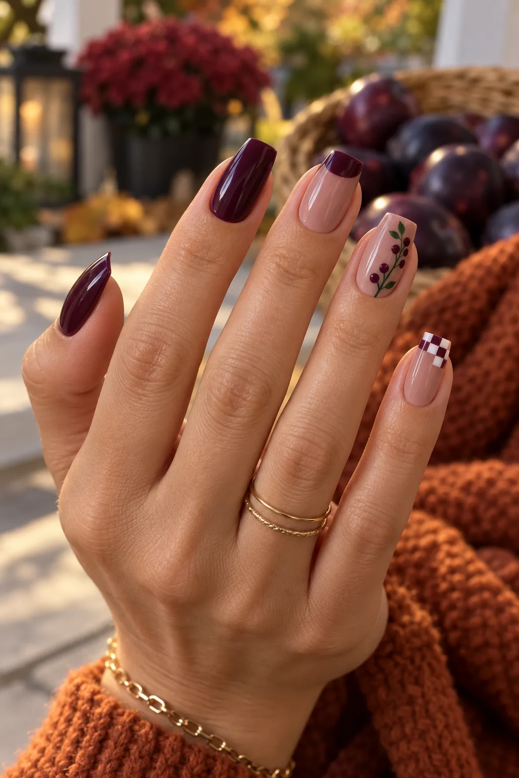 Mix and match dark plum nails for fall with berries and checkerboard