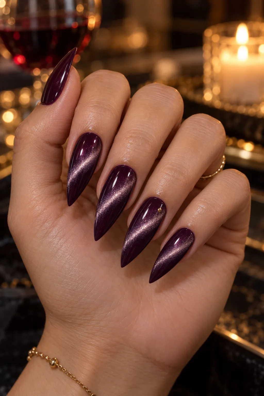 Velvet cat-eye dark plum nails for fall on slim stiletto nails