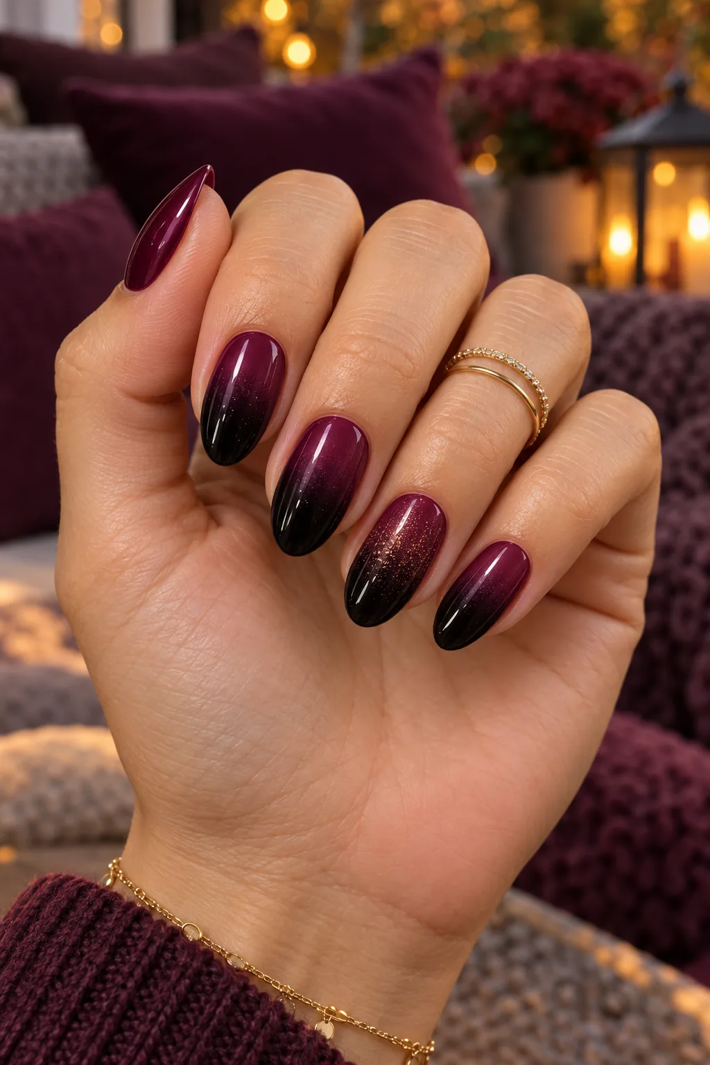 Dark plum nails for fall fading to black in a glossy ombre design