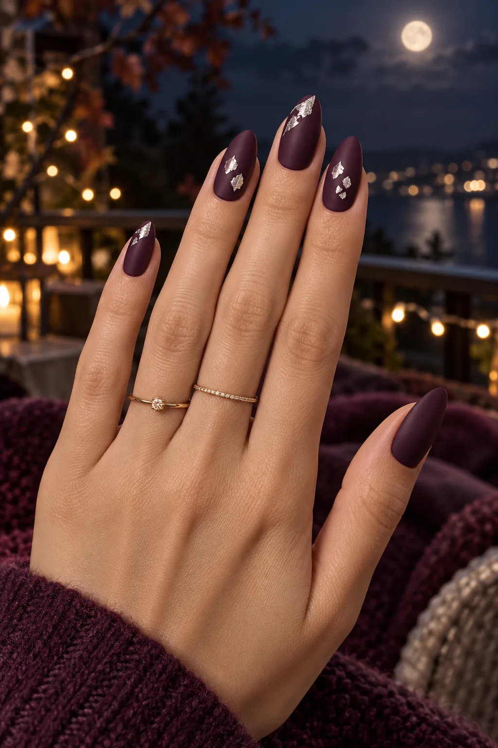 Dark plum nails for fall with torn silver foil shards
