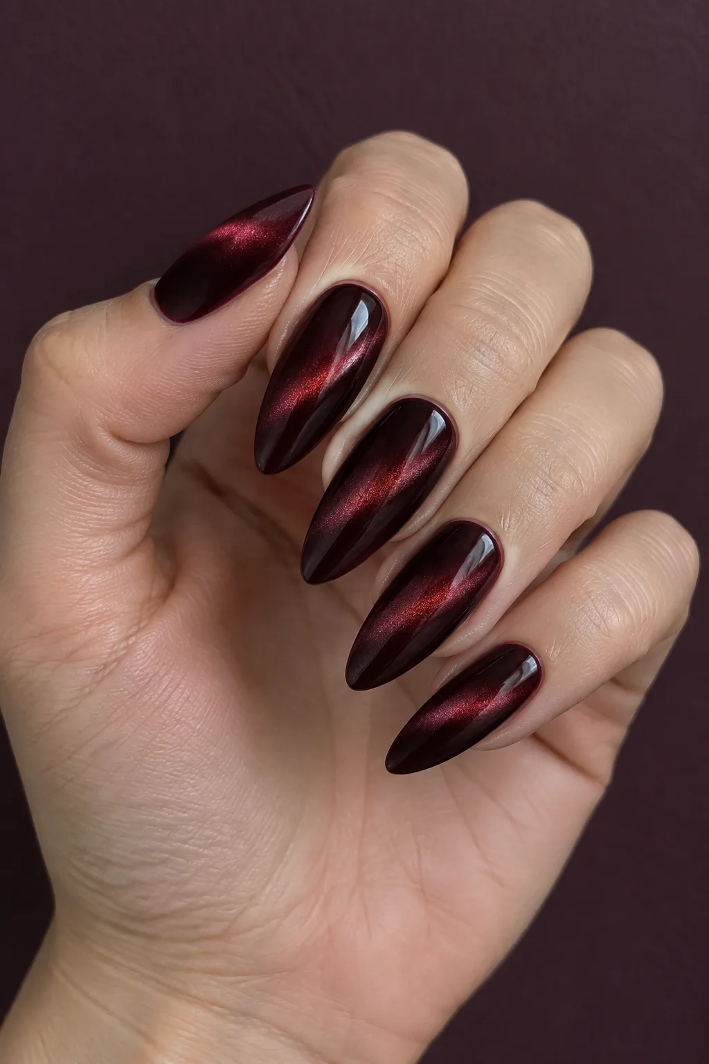 Black cherry velvet cat eye dark red fall nails on long almond