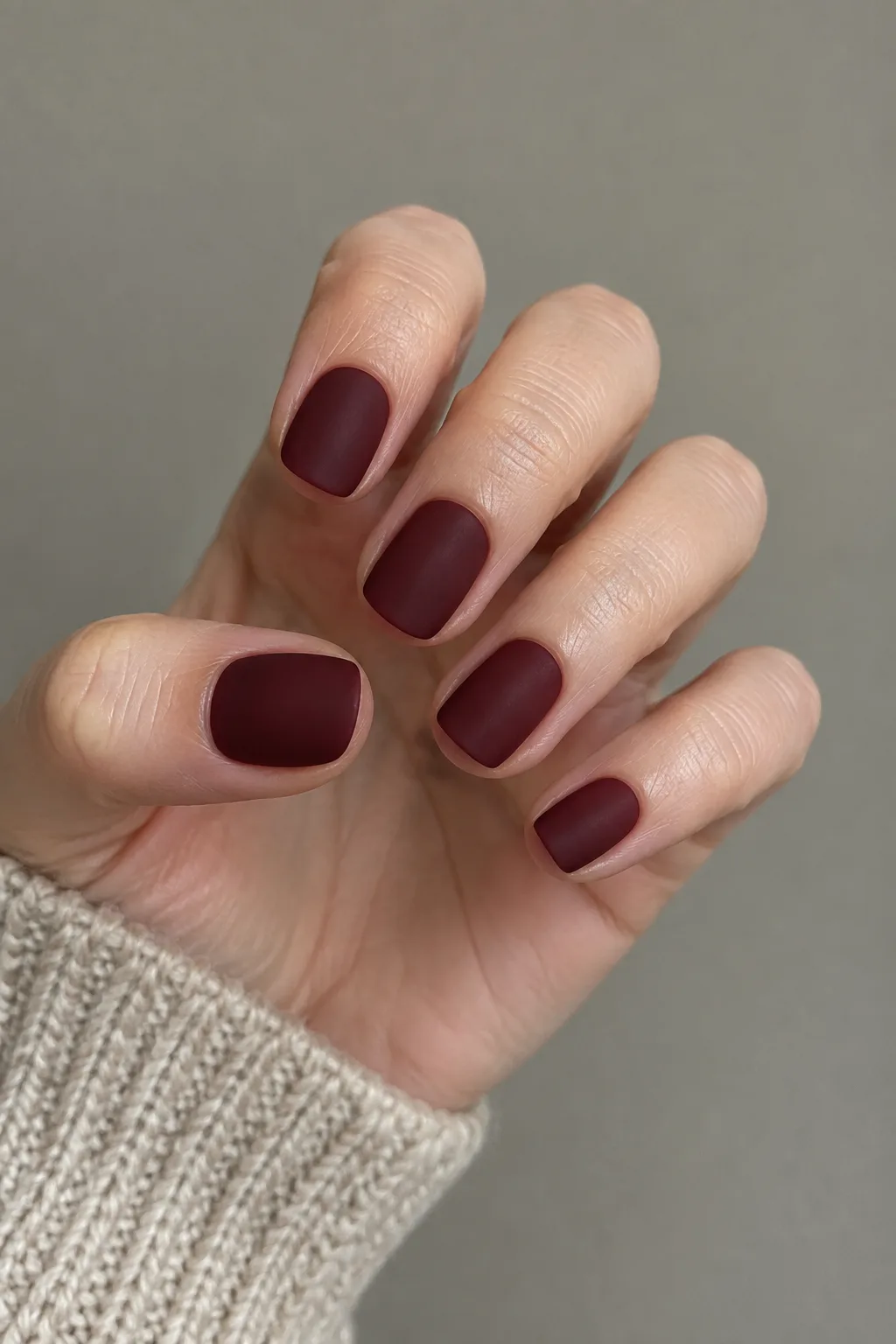 Matte deep wine squoval dark red fall nails with a suede finish