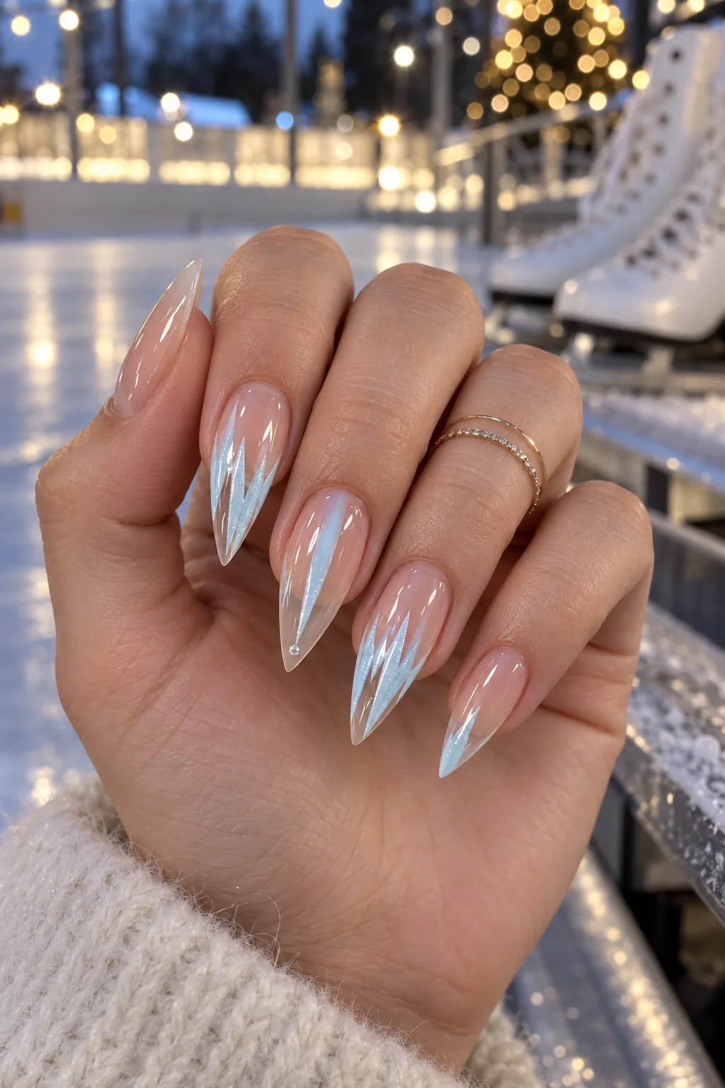December nail ideas not Christmas: icy blue icicle negative space stiletto tips