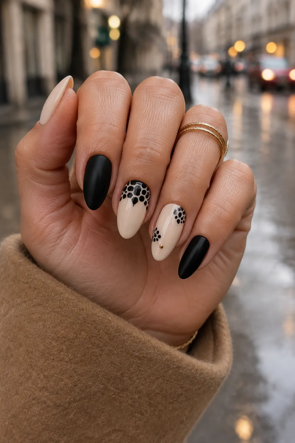 Matte black almond nails with black python print on bone