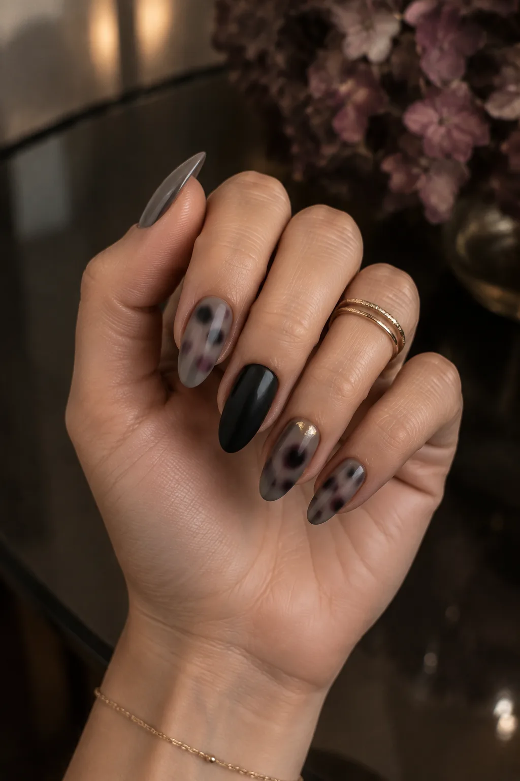 Matte black almond nails with smoke and plum tortoiseshell
