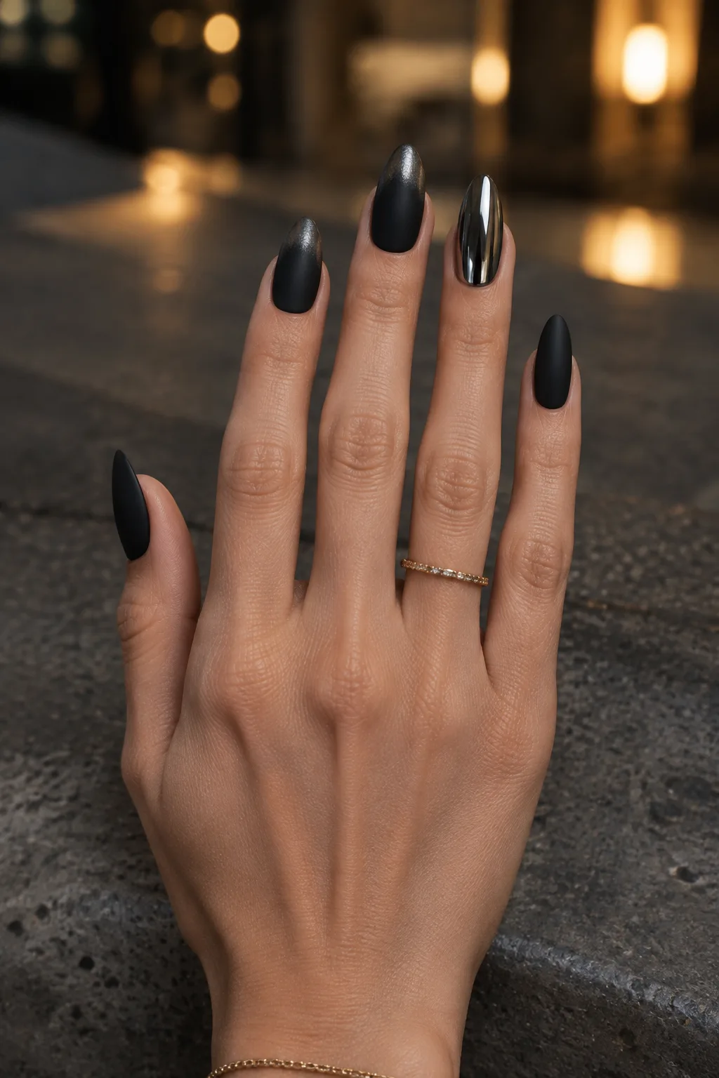 Matte black almond nails with smoky black chrome tips