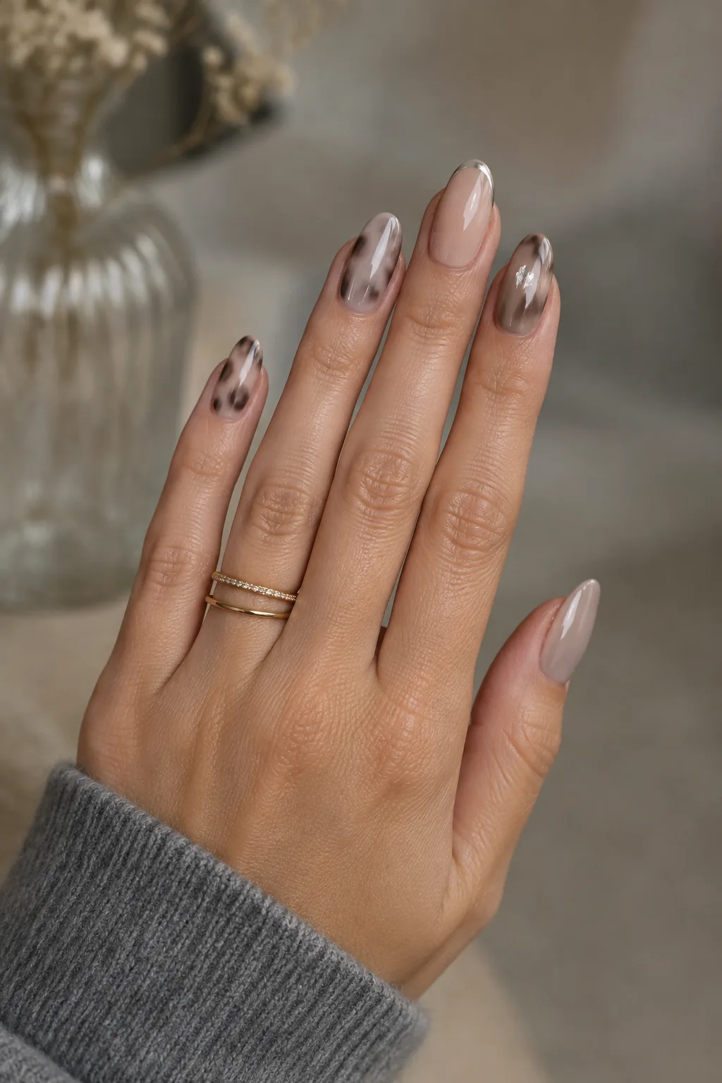 Cool taupe tortoiseshell, minimalist winter nail designs on medium oval nails