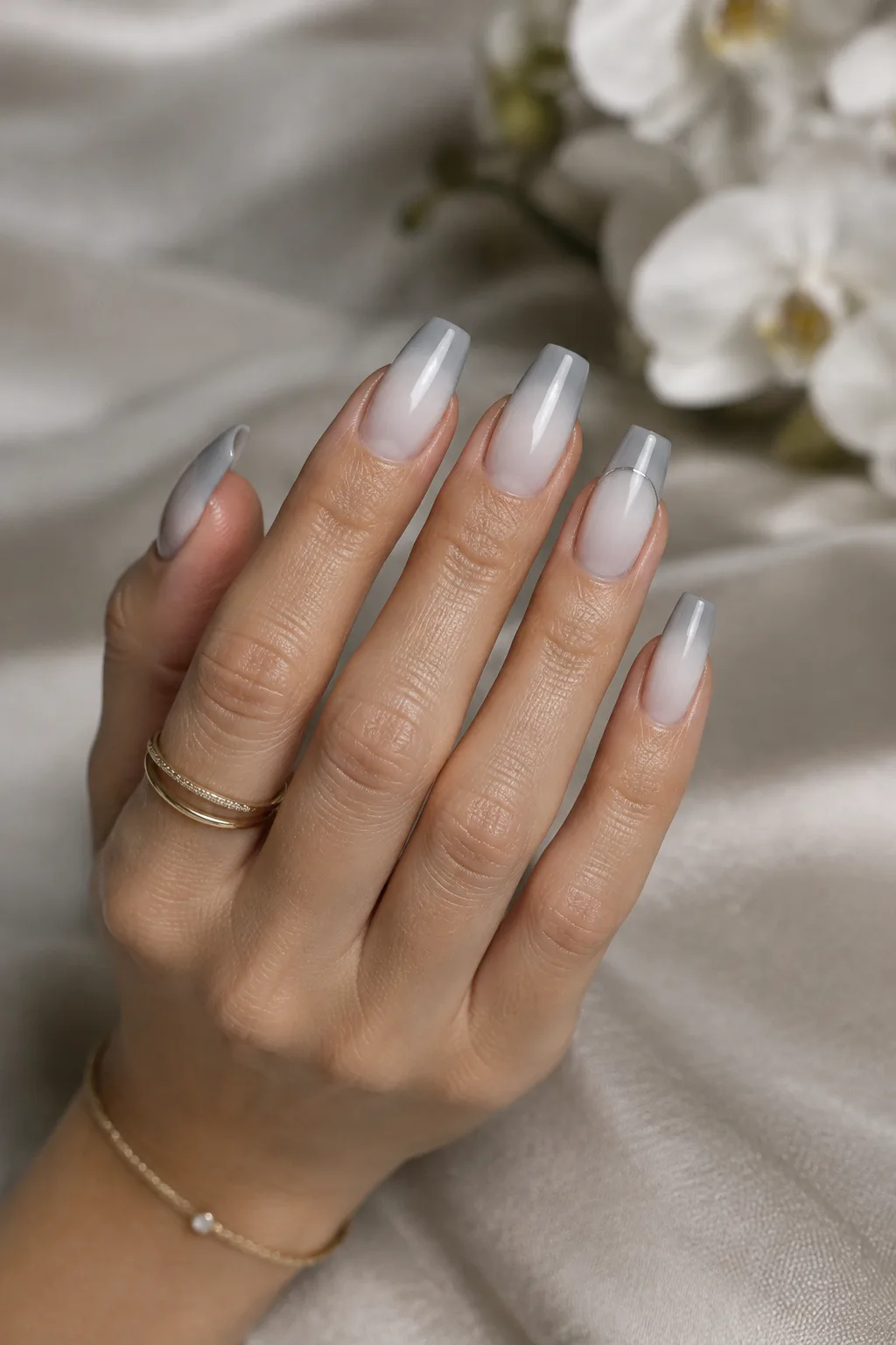 Milk to grey ombre fade, minimalist winter nail designs on flare shaped nails