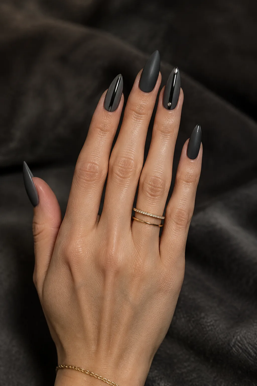 Matte charcoal with glossy stripe, minimalist winter nail designs on arrowhead nails