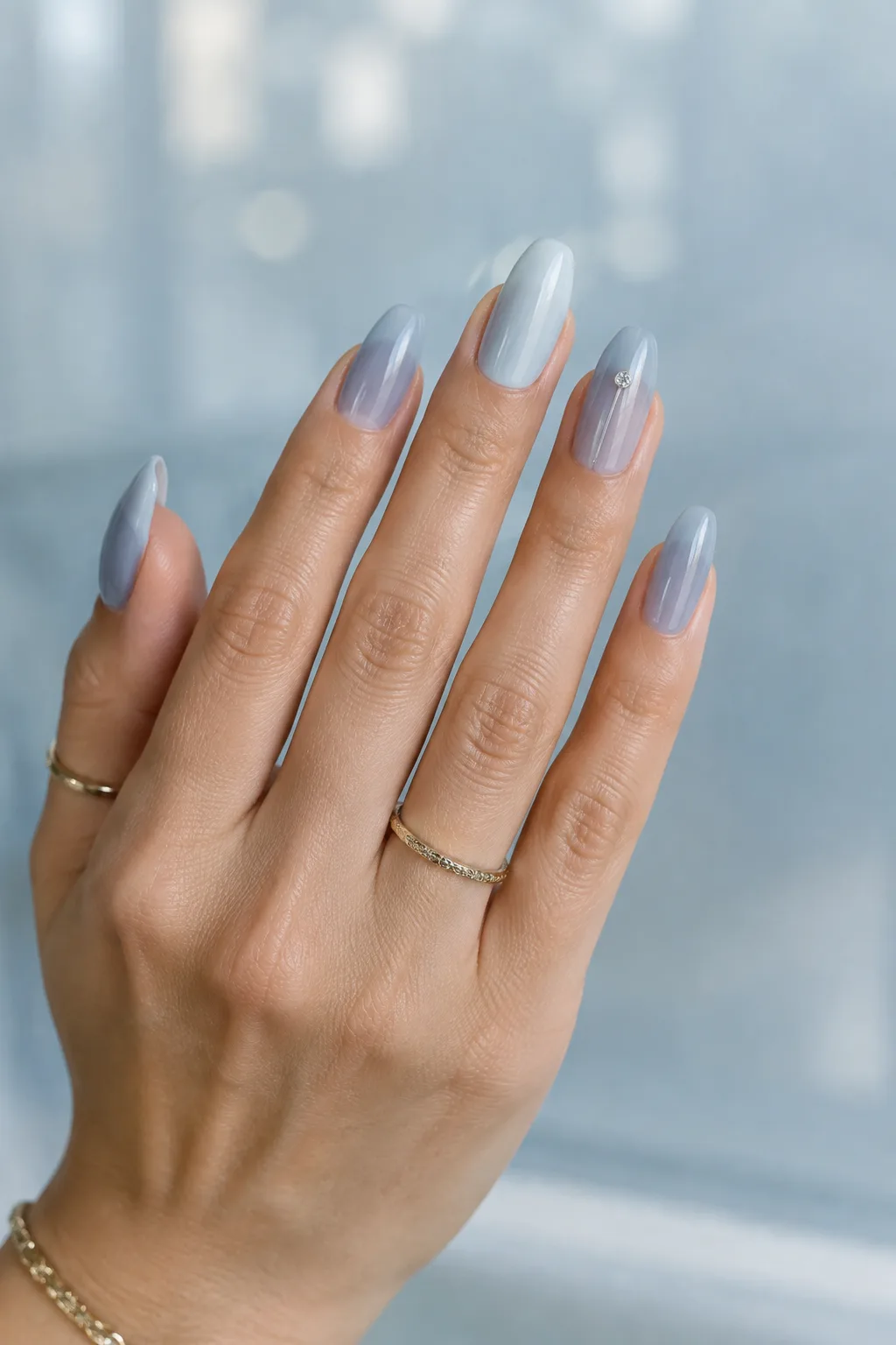 Icy blue grey jelly nails, minimalist winter nail designs on long edge shaped nails
