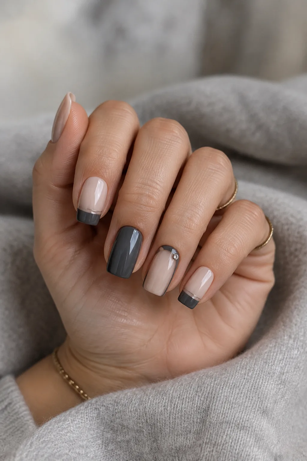 Floating charcoal tips on bone, minimalist winter nail designs on short coffin nails