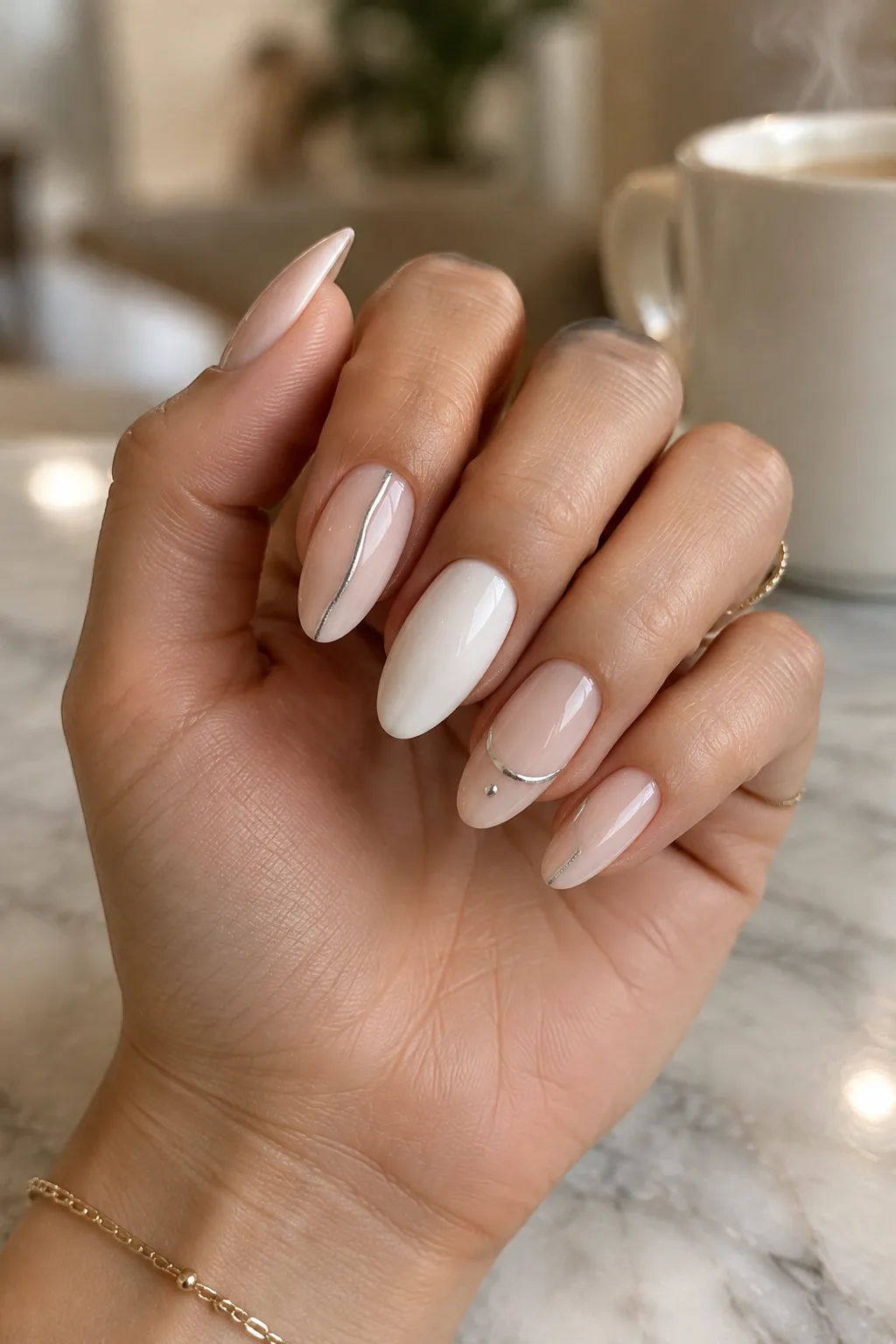 Single silver hairline on bone nails, minimalist winter nail designs on long oval nails