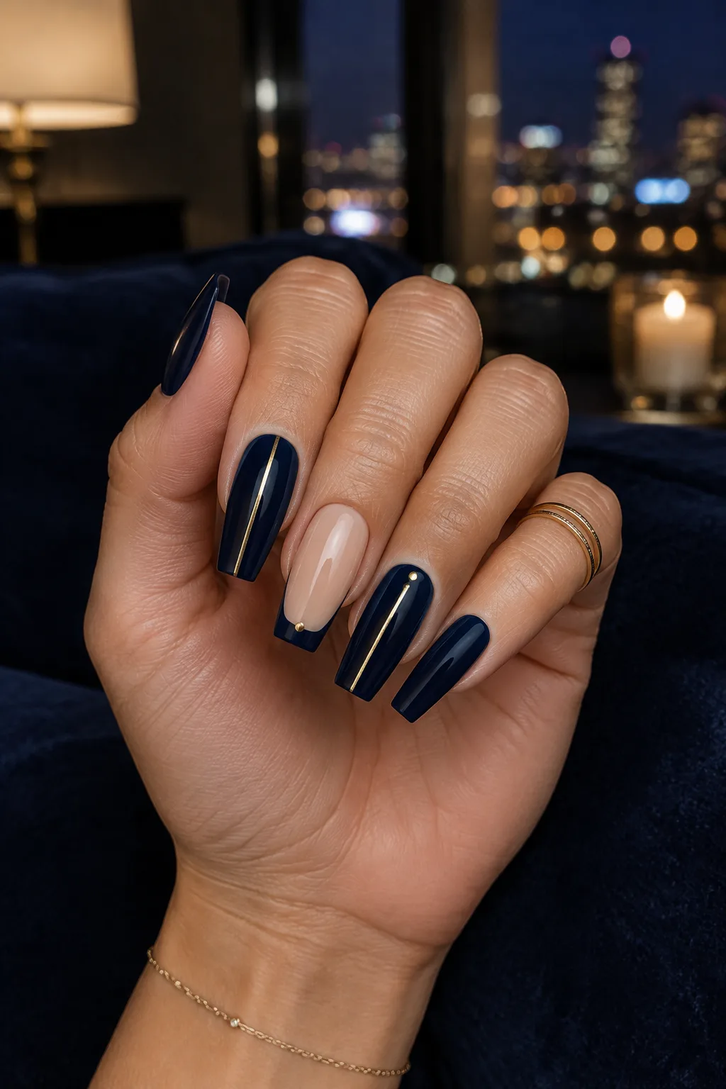 Navy nails with gold line to wear with a gold party dress
