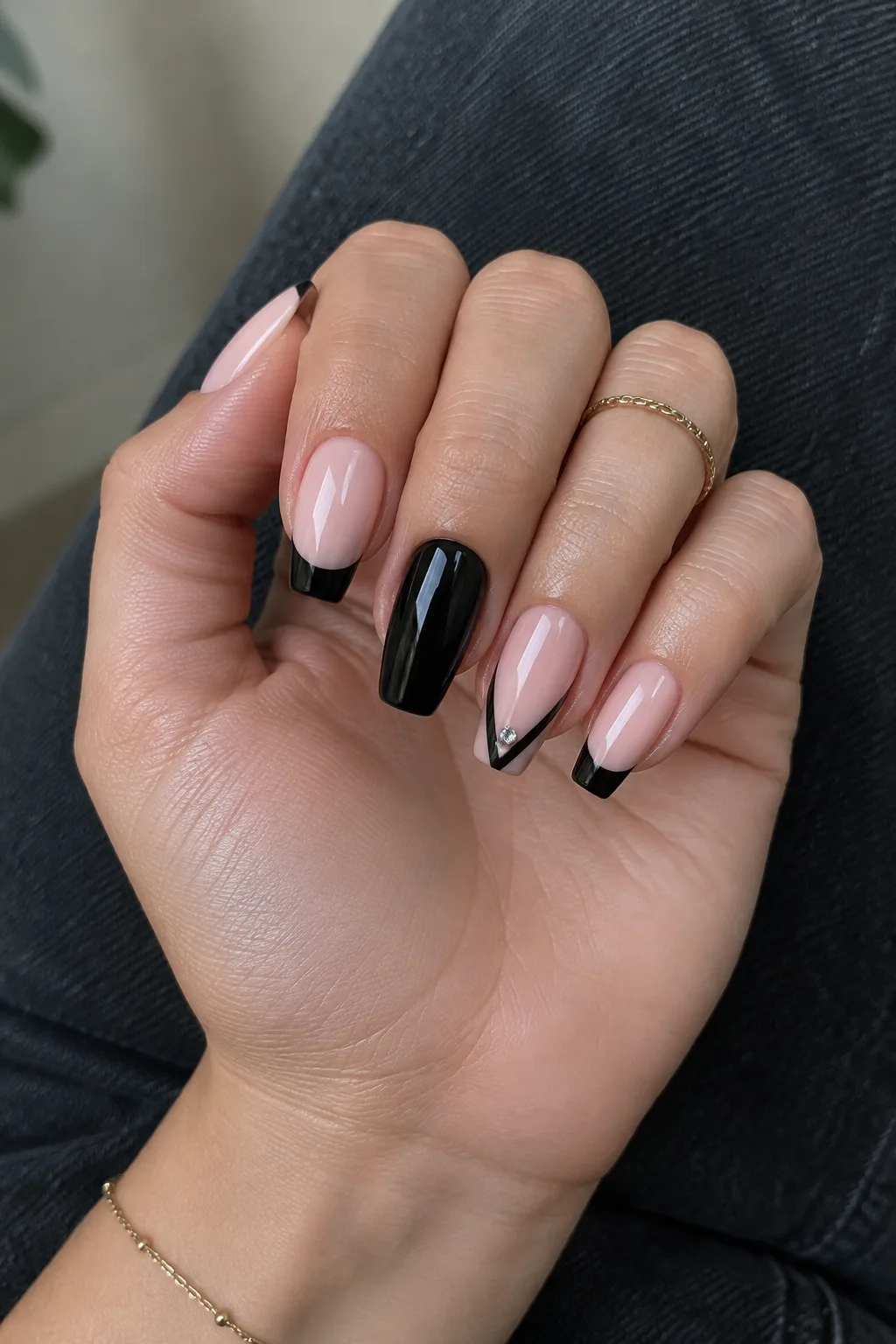 Black French tips on nude coffin nails, nails to wear with a red dress