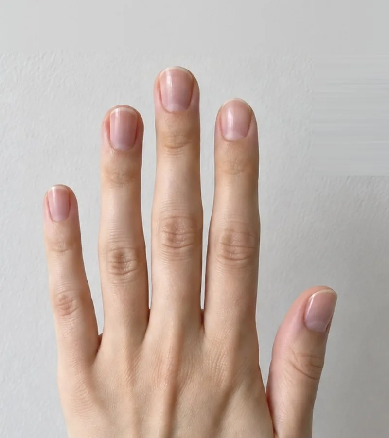 The same hand before: bare natural nails