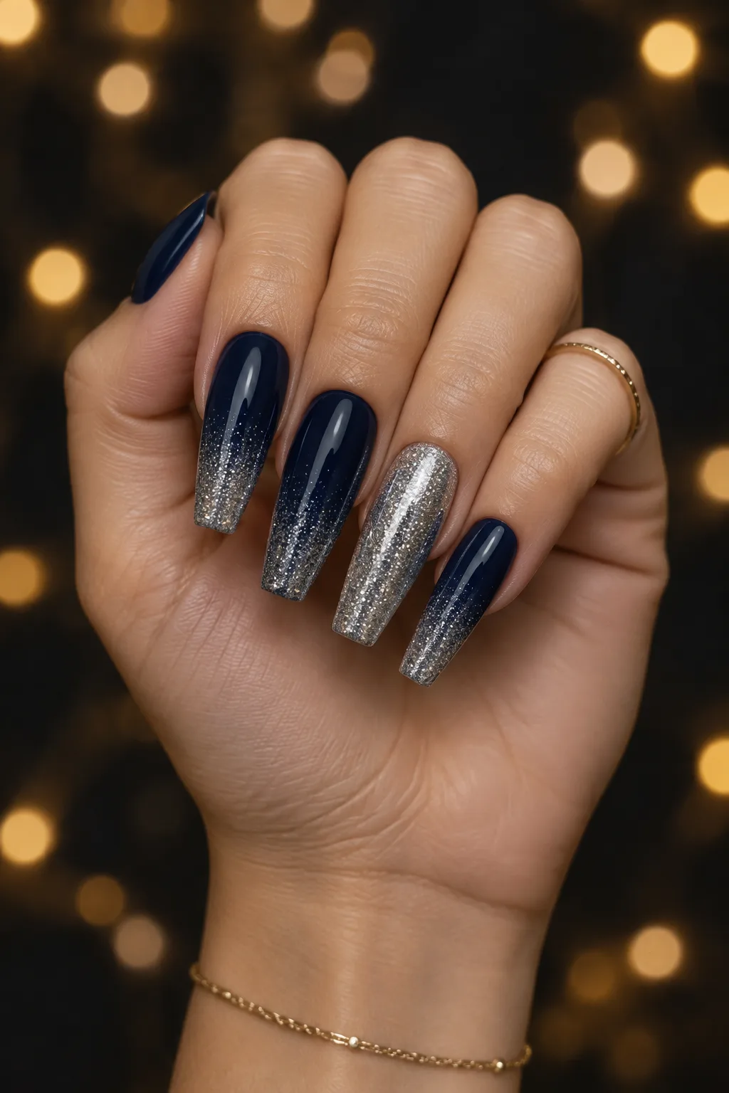 Navy coffin nails with silver glitter fading from the tips for winter