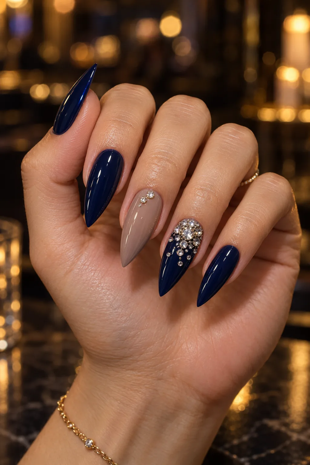 Long navy blue stiletto nails with crystal cluster, winter nail design