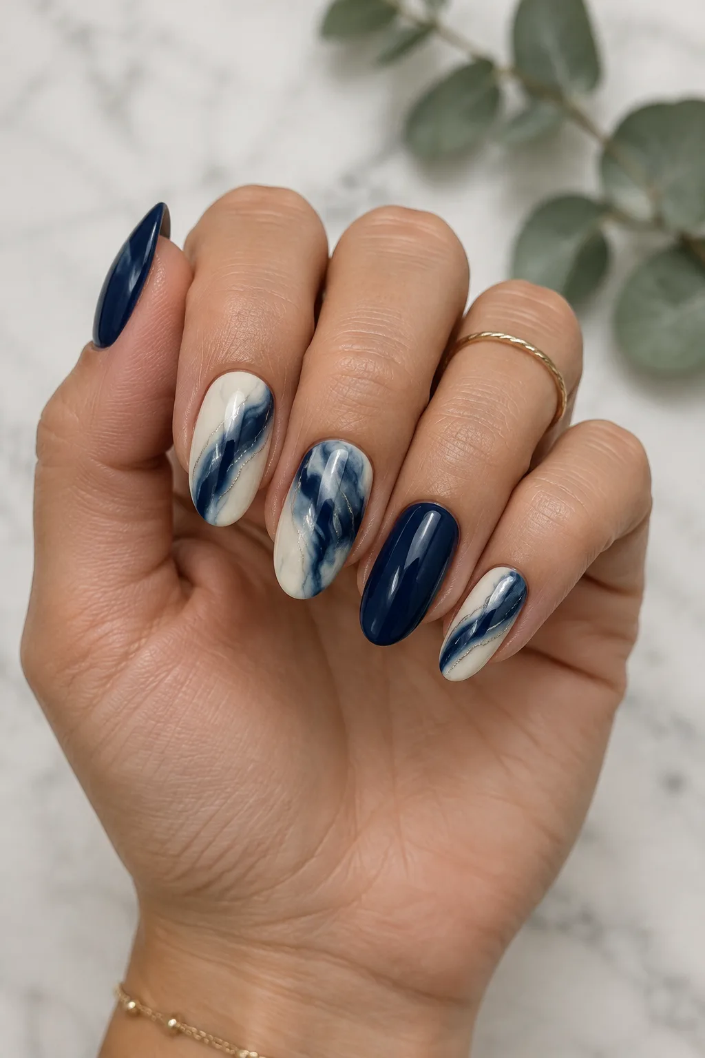 Navy and cream marble nails with silver veins, winter navy blue nail design