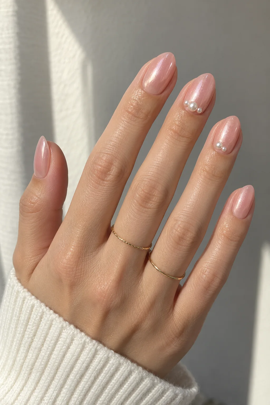 Pearl beads on blush glazed nails for New Year's Eve