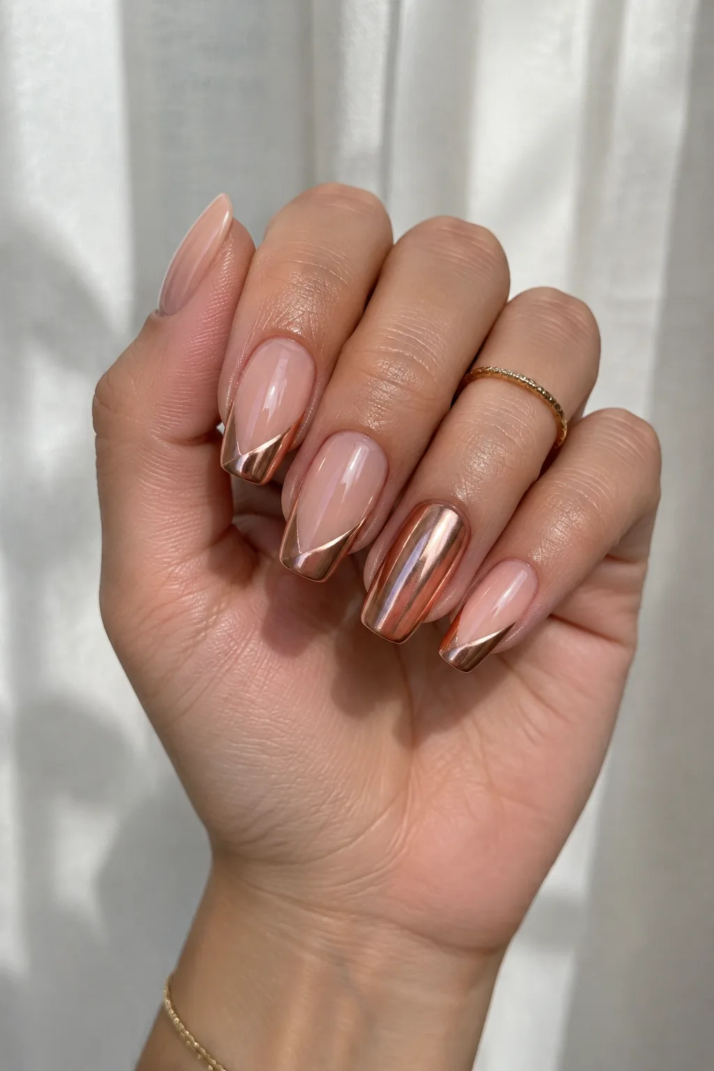 Rose gold chrome French tip New Year's Eve nails 2027 on lipstick shape nails