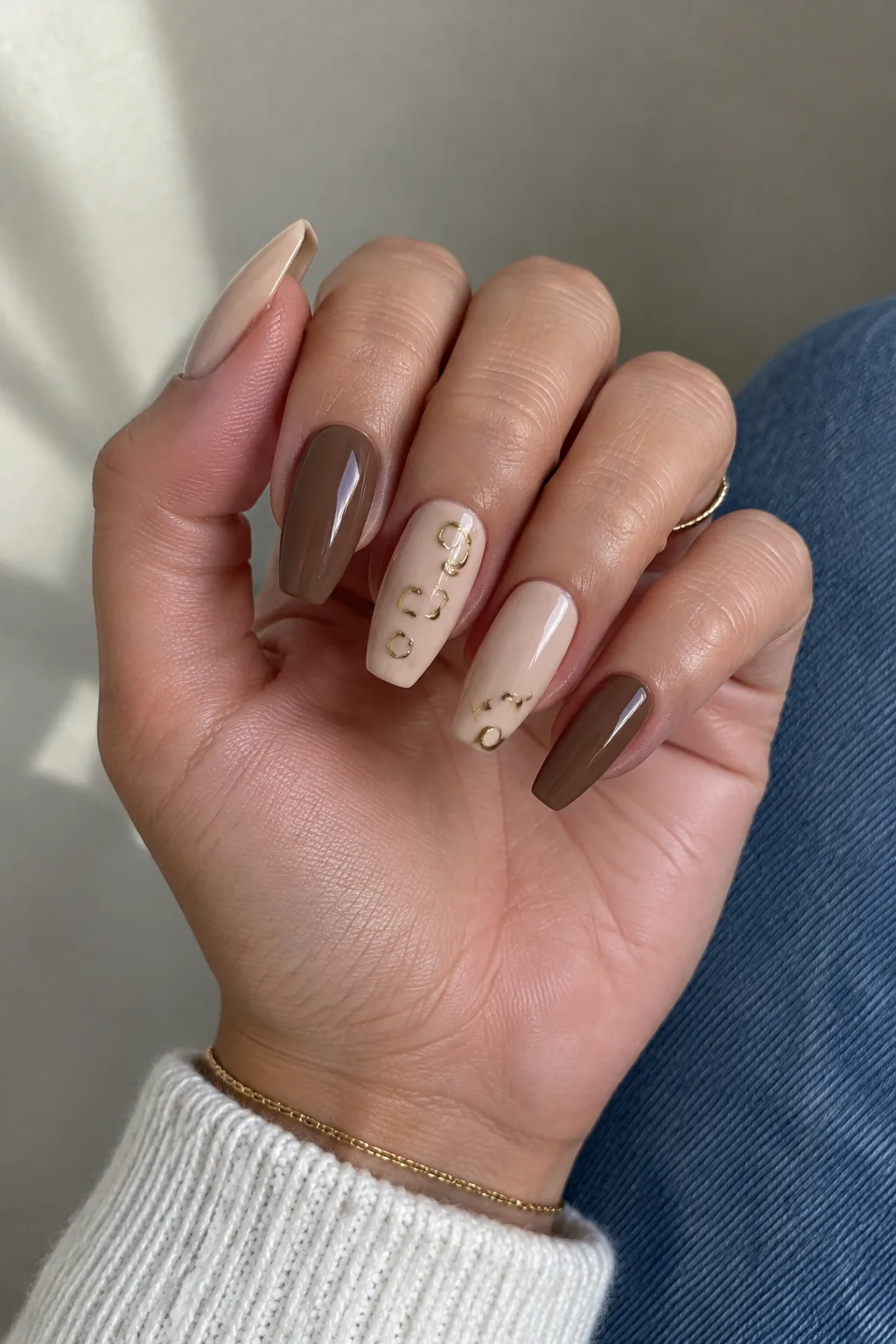 Mocha and gold spot New Year's Eve nails 2027 on flare duck tip nails