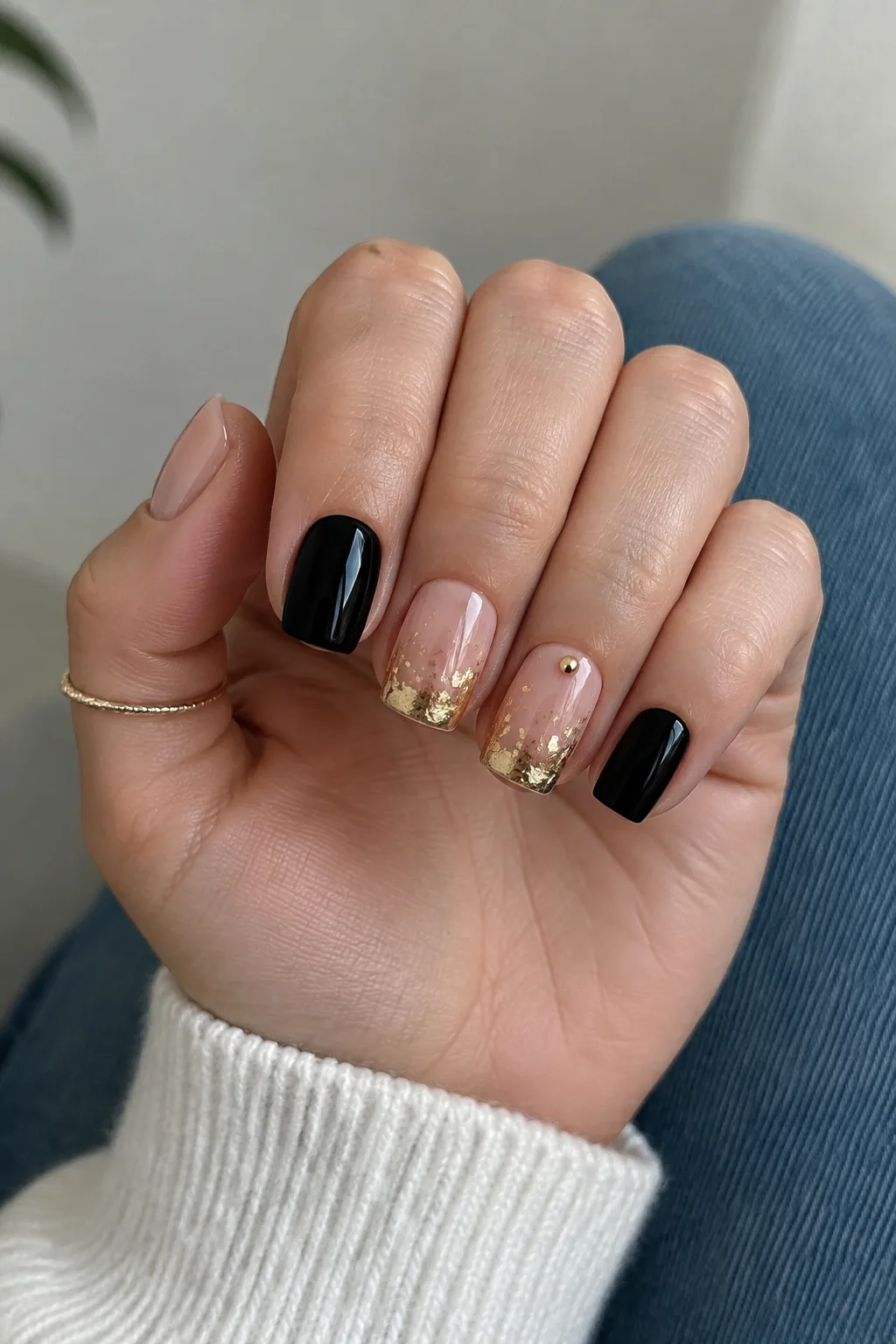 Black and gold confetti New Year's Eve nails 2027 on short square nails