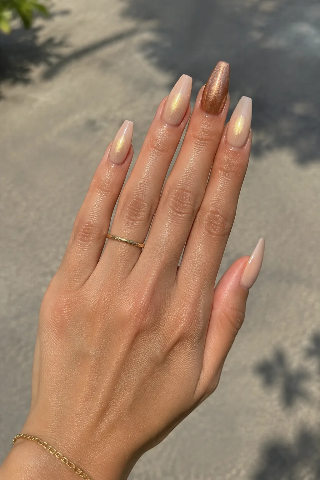 Champagne gold aura New Year's Eve nails 2027 on long coffin nails