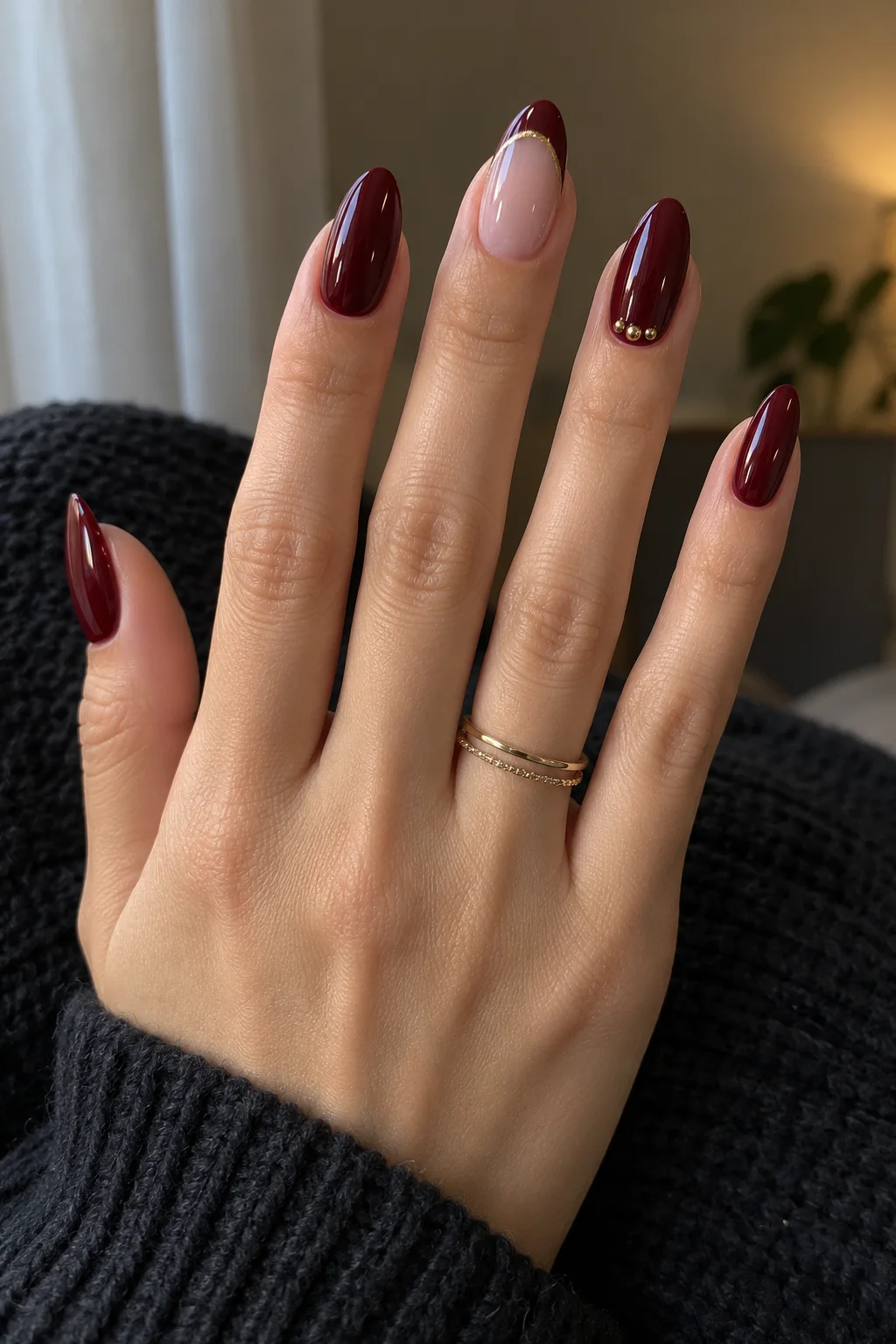 Oxblood nails with gold caviar beads for New Year's Eve