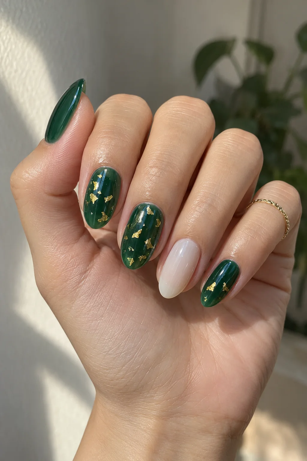 Emerald jelly nails with gold leaf for New Year's Eve