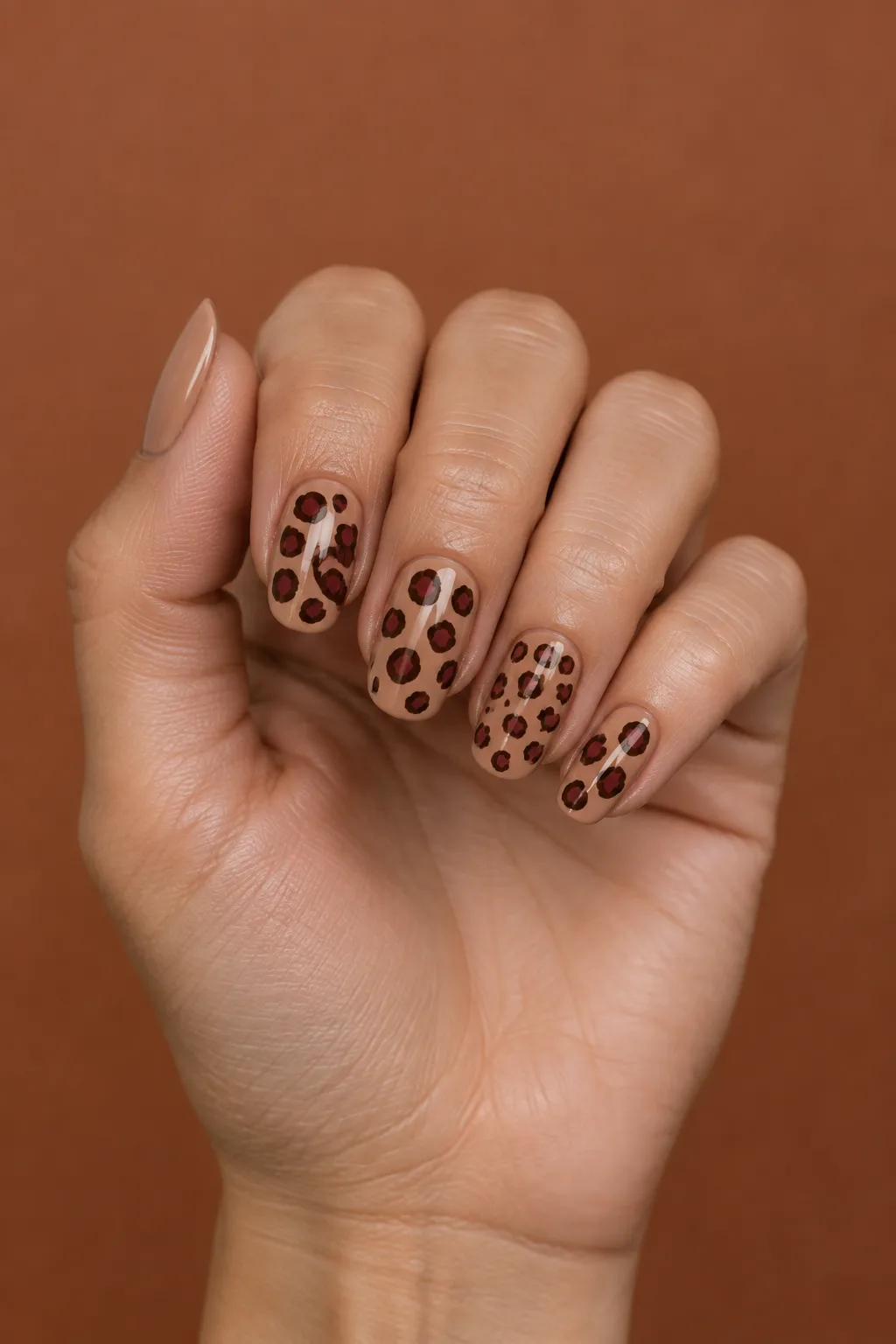 Camel nails with oxblood leopard spots, bold October nails ideas 2026