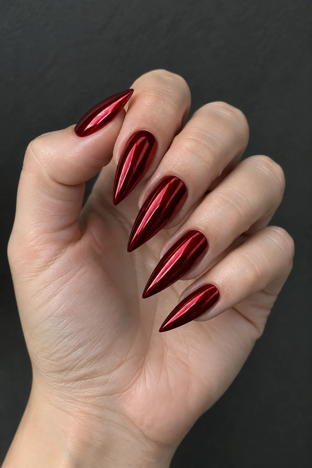 Blood red chrome stiletto nail designs with a mirror metal finish