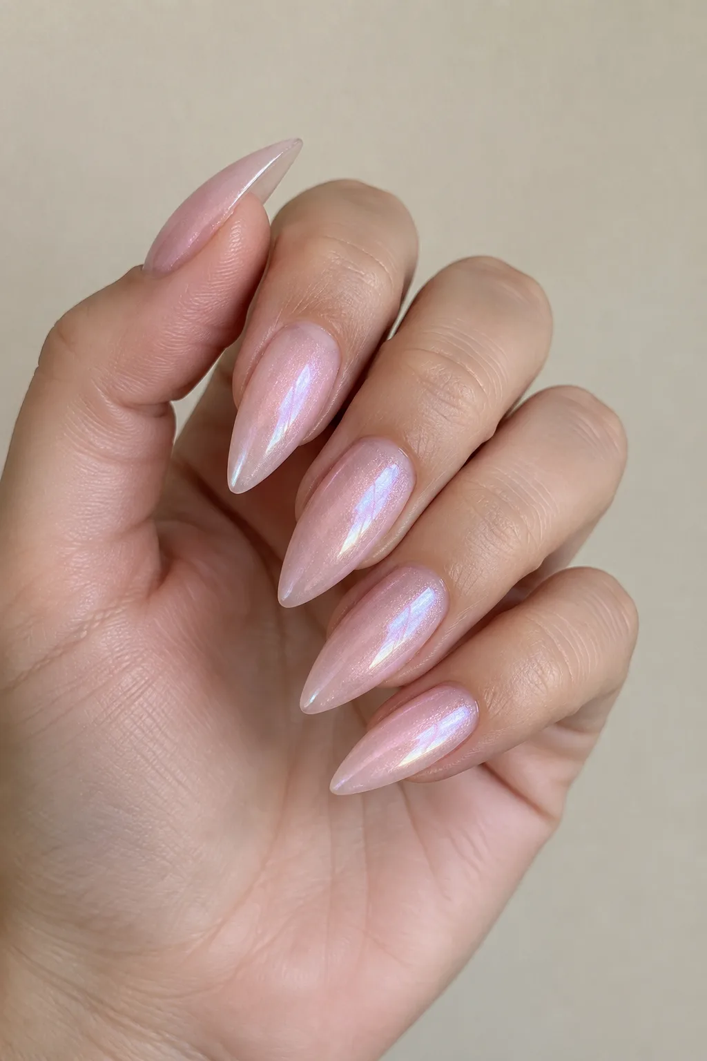 Milky pink pearl stiletto nail designs with a soft shimmer