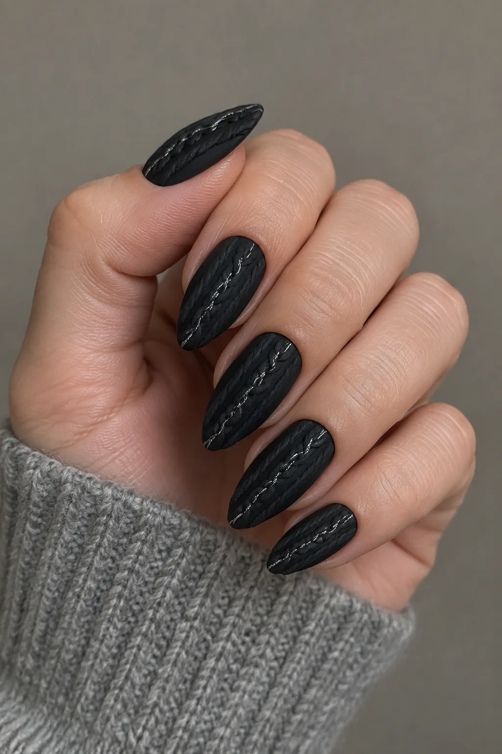 Black cable knit sweater nails with silver thread on edge shaped nails